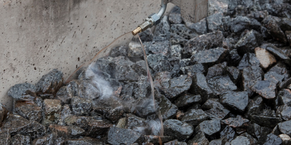 Bonded track ballast with open voids